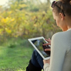 woman-using-tablet-outside-web